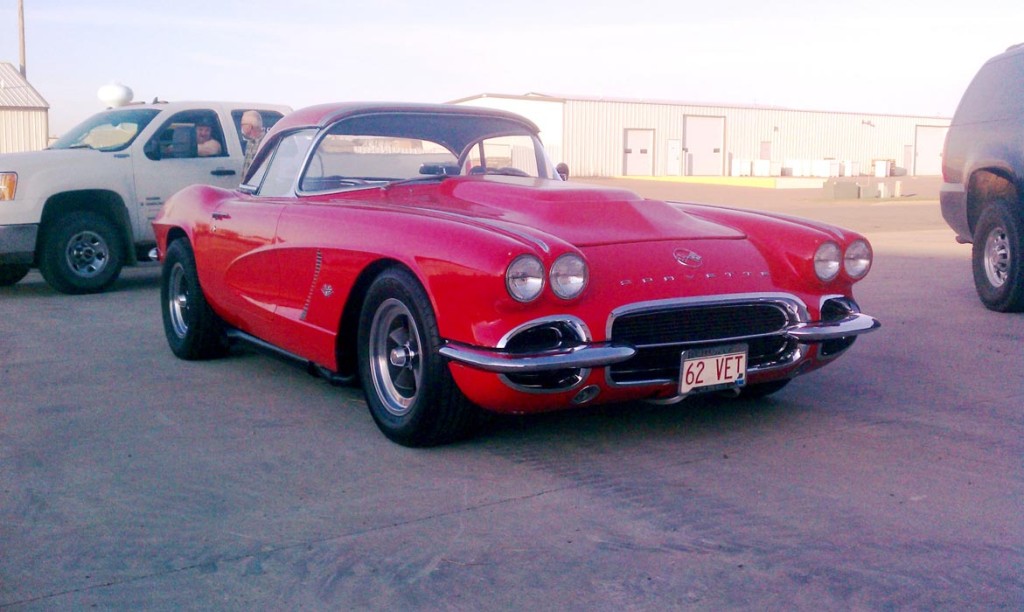 bright red corvette with 62 vet license plate