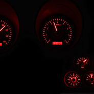 A set of 1968-1977 Corvette Dakota Digital VHX Gauges on a black background.