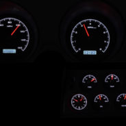 A set of 1968-1977 Corvette Dakota Digital VHX Gauges on a black background.