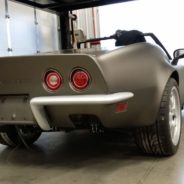 sleek gray corvette with red rear lights