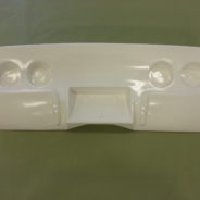 A 1968-1982 CORVETTE REAR TAILLAMP PANEL - GRAFT ON with four compartments on it.