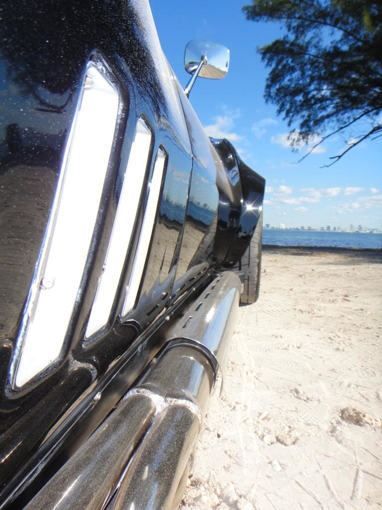 closeup black corvette windows and mirror
