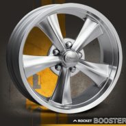 An image of a ROCKET BOOSTER HYPER SILVER wheel with a yellow background.