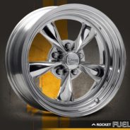 A ROCKET FUEL CHROME wheel on a yellow background.