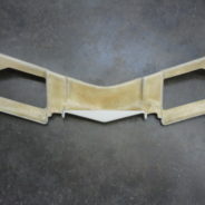 A 1968-1972 CORVETTE LOWER VALANCE PANEL that has been cut into the shape of a wing.