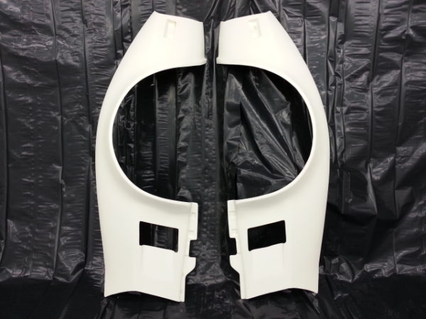A pair of 1973-1979 CORVETTE FRONT FENDERS - 2" FLARE on a black background.