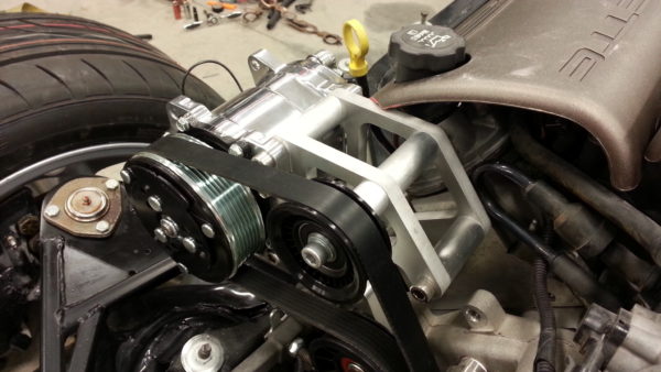 A picture of a car with LS1 SWAP AC BRAKETS FOR THE SANDEN COMPRESSOR attached to it.
