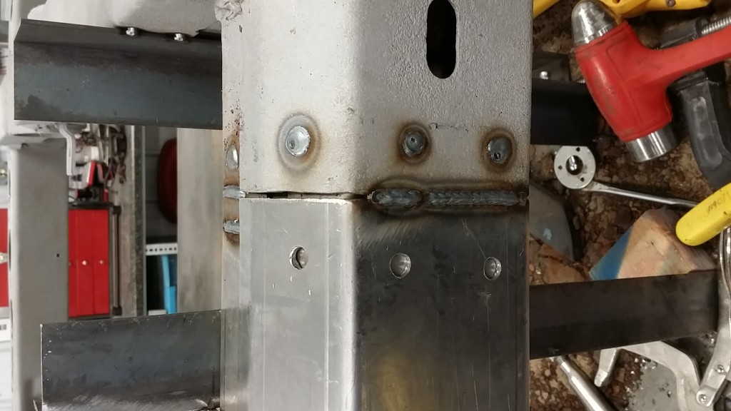 A picture of a metal pole with tools on it.