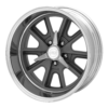 A VN427 Shelby Cobra wheel on a black background.