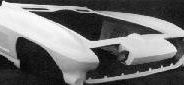 A black and white photo of a car with an ACI 1963-1967 ONE PIECE FRONT END hood.