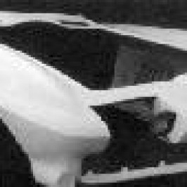 A black and white photo of a car with an ACI 1963-1967 ONE PIECE FRONT END hood.