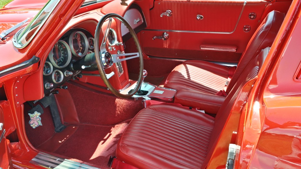 The interior of a red classic car.