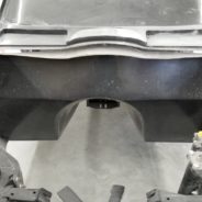 The rear end of a 1963-1967 Corvette Replica Coupe in a garage.