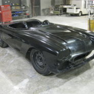 A 1962 Corvette Replica Roadster is sitting in a garage.