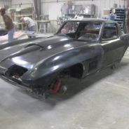 A 1963-1967 Corvette Replica Coupe is being worked on in a garage.