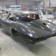 A 1963-1967 Corvette Replica Coupe sitting in a garage.