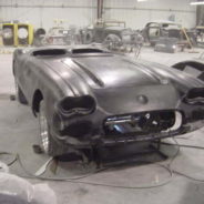 A 1958-1960 Corvette Replica Body Kit is being worked on in a garage.