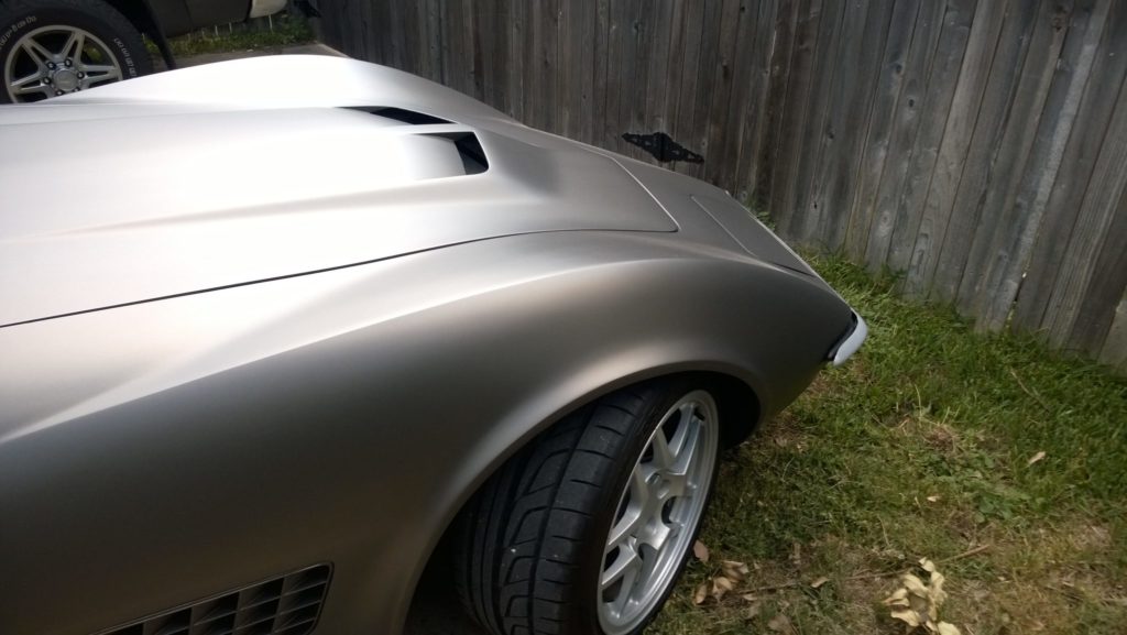 gray corvette parked in driveway 4
