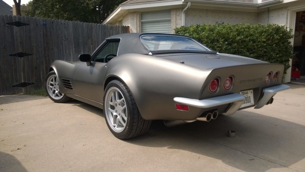 gray corvette parked in driveway