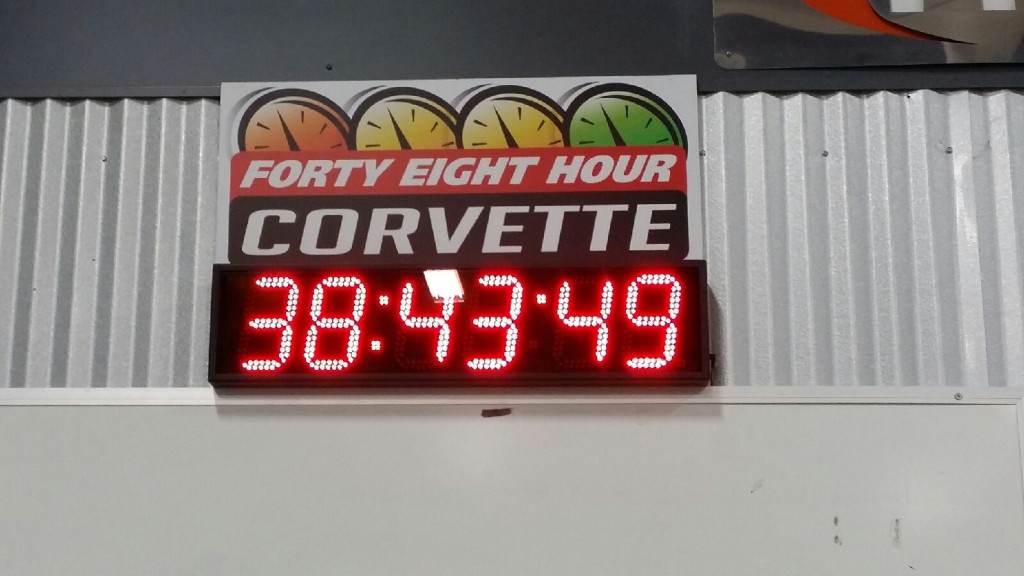 A sign that says forty eight hour corvette.