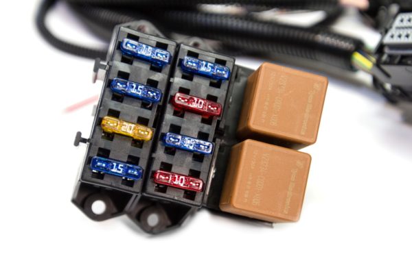 A '10 - '13 L99 (6.2L) STANDALONE WIRING HARNESS W/T56/TR6060 fuse box with several different colored wires.