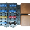 A set of four different colored '06 - '07 24X GEN IV LS2 W/ 4L60E STANDALONE WIRING HARNESS (DBW) relays on a white background.