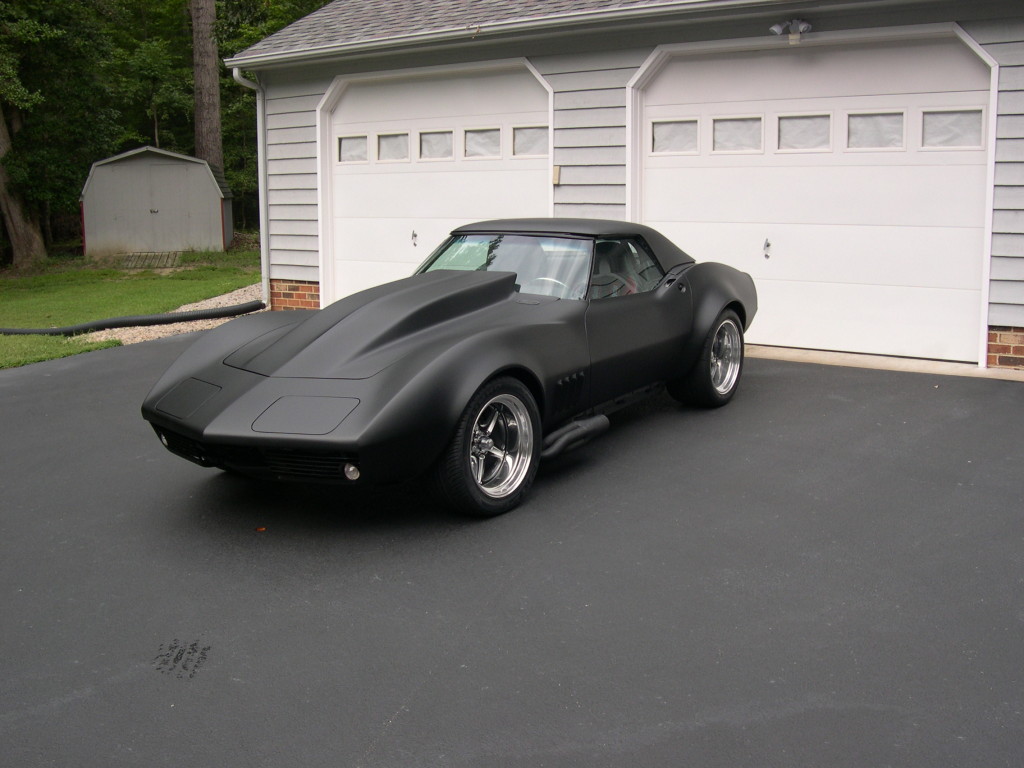 black corvette parked in driveway