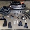 A RESTOMOD AIR - 1968-1974 CORVETTE TRUMOD COMPLETE A/C SYSTEM - ORIGINAL FACTORY AIR with hoses and hoses on a table.