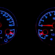 Two DAKOTA DIGITAL HDX 3-1 GAUGES with blue lights on them.