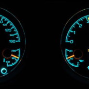 Two DAKOTA DIGITAL HDX 3-1 GAUGES are shown in the dark.