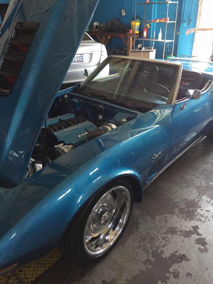 corvette with hood open and engine exposed in deep blue 2