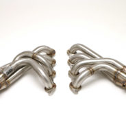 A pair of C2 / C3 Corvette LS Conversion Mid-Length Header exhaust pipes on a white background.