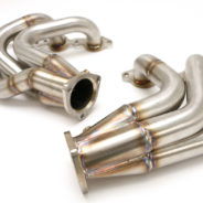 A pair of C2 / C3 Corvette LS Conversion Mid-Length Headers on a white background.