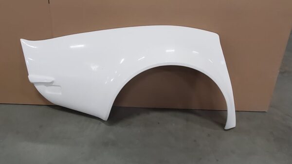 A white plastic 1968-1972 FLARED FENDER KIT 4" FRONTS, 5" REARS for a car.