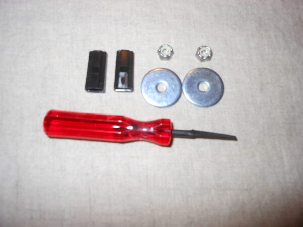 A red screwdriver, pliers, and a set of screws.