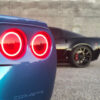 The DIODE DYNAMICS HD LED TAIL LIGHT HALO RINGS (SET OF 4) of a blue sports car.