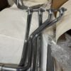 A group of C2/C3 CORVETTE LS SWAP STAINLESS STEEL SIDE EXIT HEADERS - POLISHED FINISH.